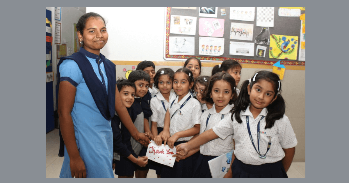 CHIREC students expressing gratitude with a 'Thank You' card to the helping staff.